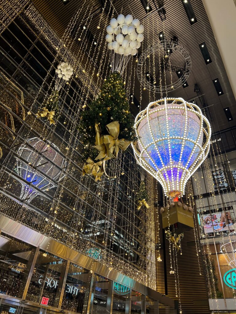 Hudson Yards complex in New York City featuring modern architecture and The Vessel at night