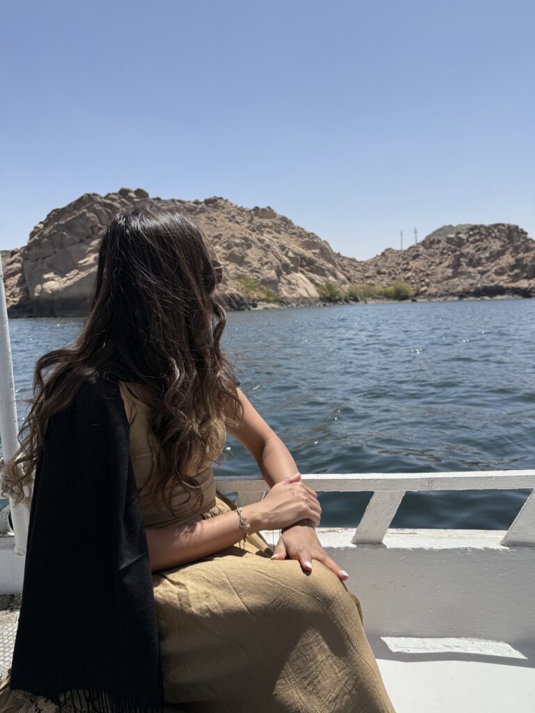 Woman enjoying Nile River ferry crossing to Valley of the Kings in Luxor, Egypt