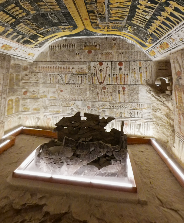 Painted tomb interior with colorful ceiling and excavated stone remains at Valley of the Kings, Luxor