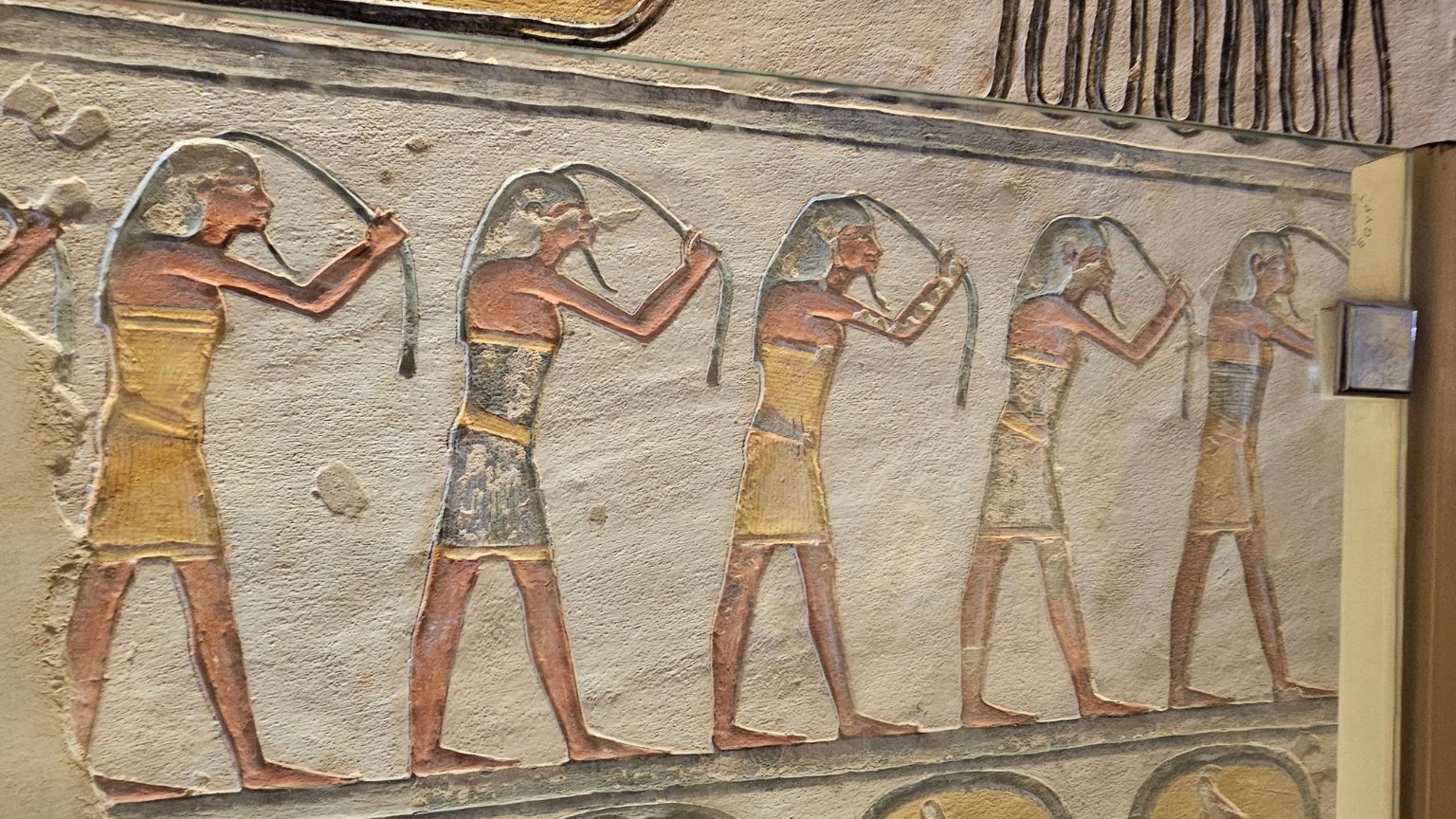 Ancient Egyptian wall painting showing procession of figures in Valley of the Kings tomb, Luxor